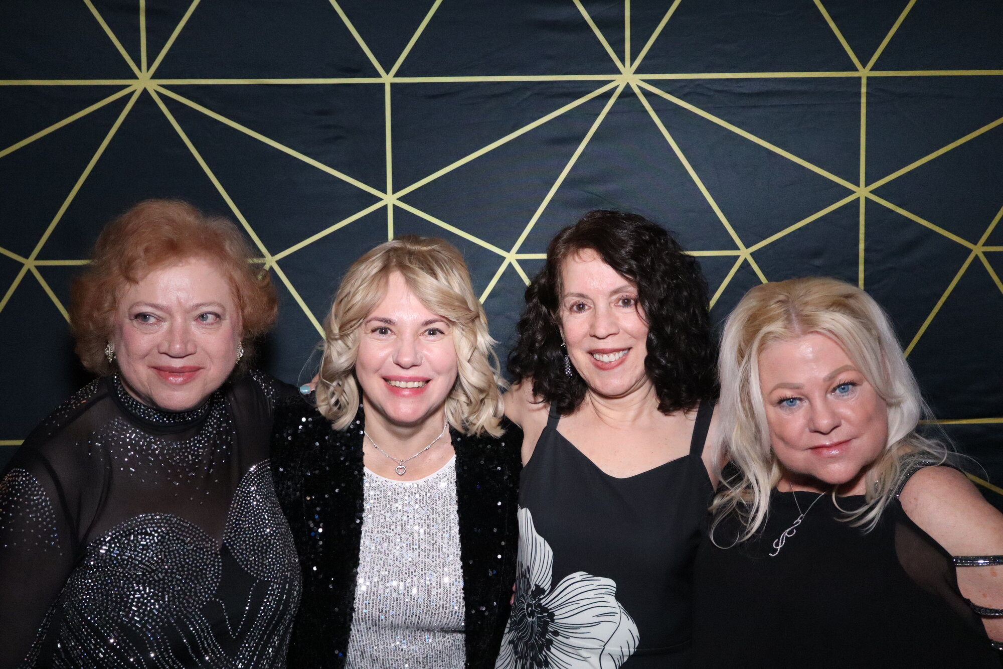 Guests posing in the photo booth at Maravela's New Year's Eve Gala