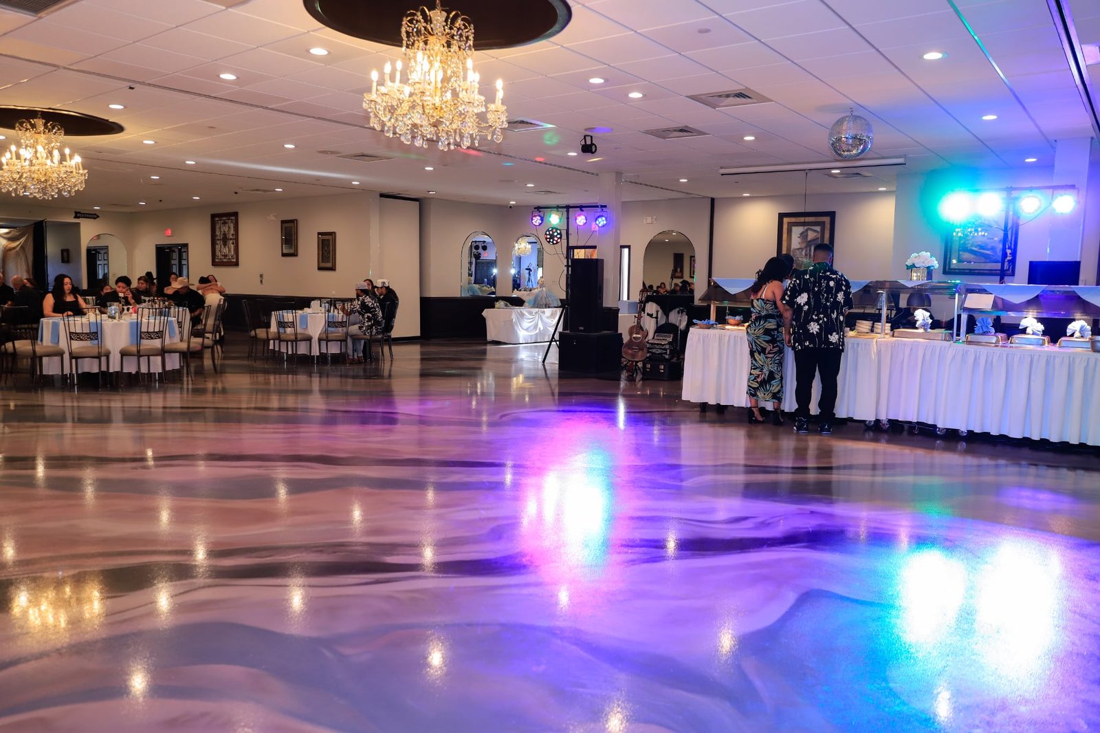 The new marbled ballroom floor at Maravela's glows under colored uplighting