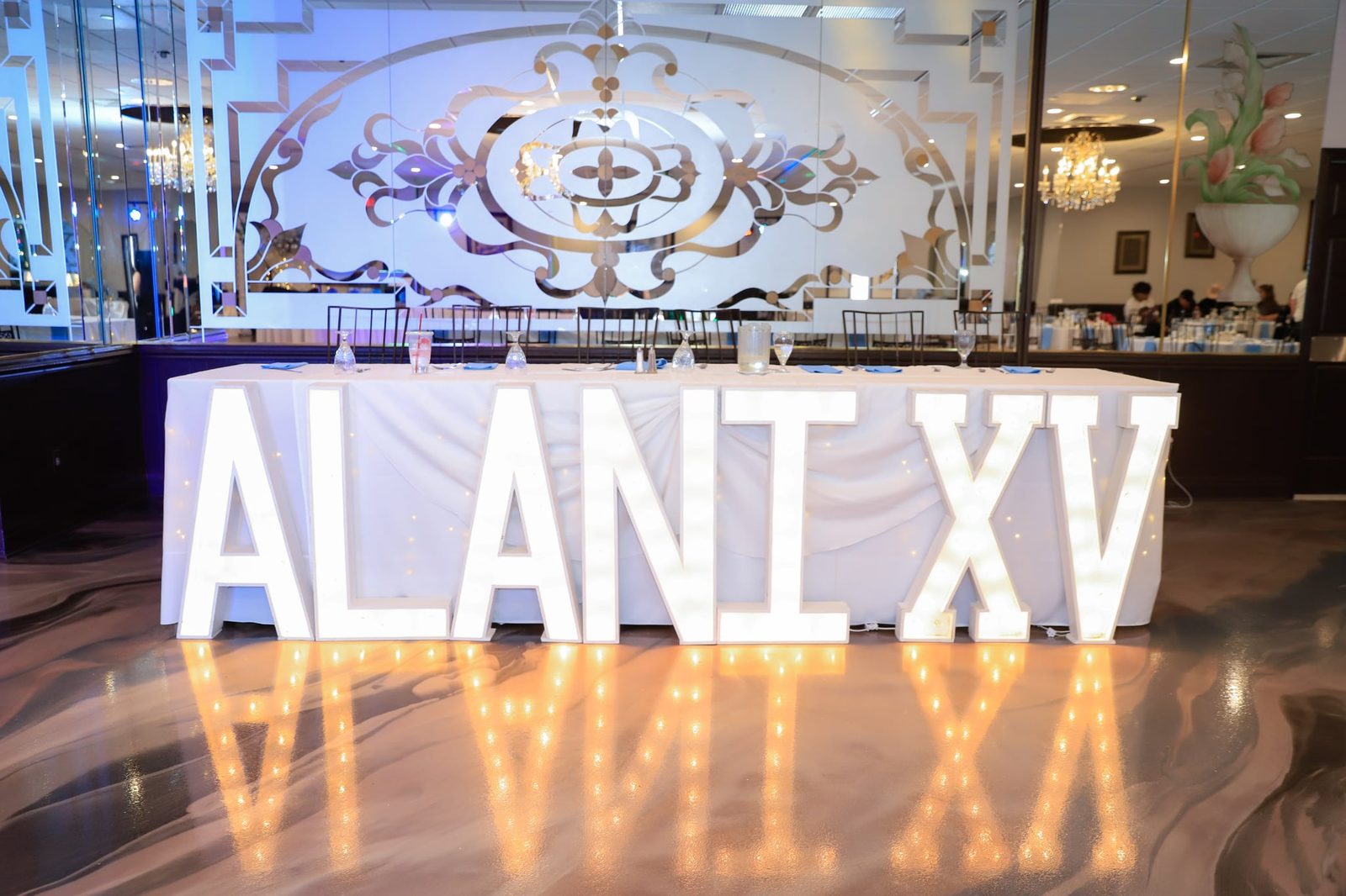 Custom ALANI XV marquee letters reflected in the new marbled floor at Maravela's