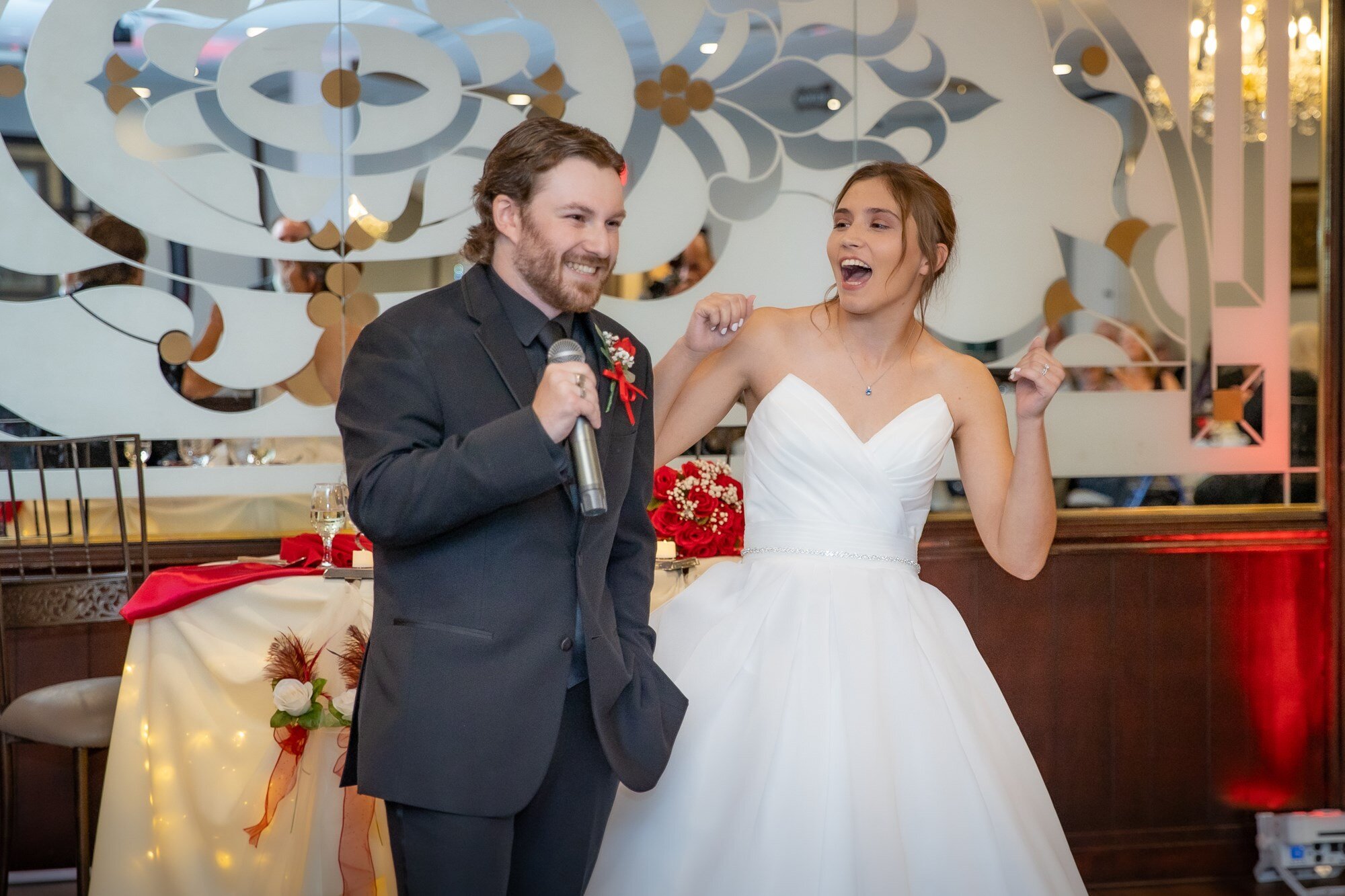 Couple seated at the sweetheart table at a Maravela's wedding