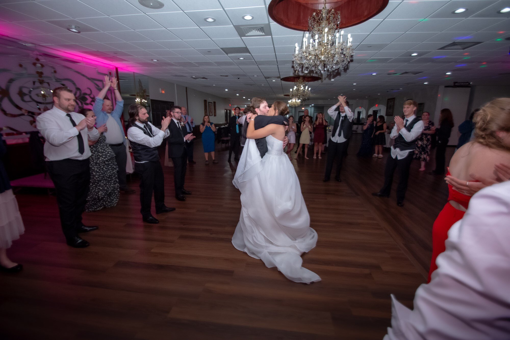 Guests applauding during the first dance at a Maravela's wedding