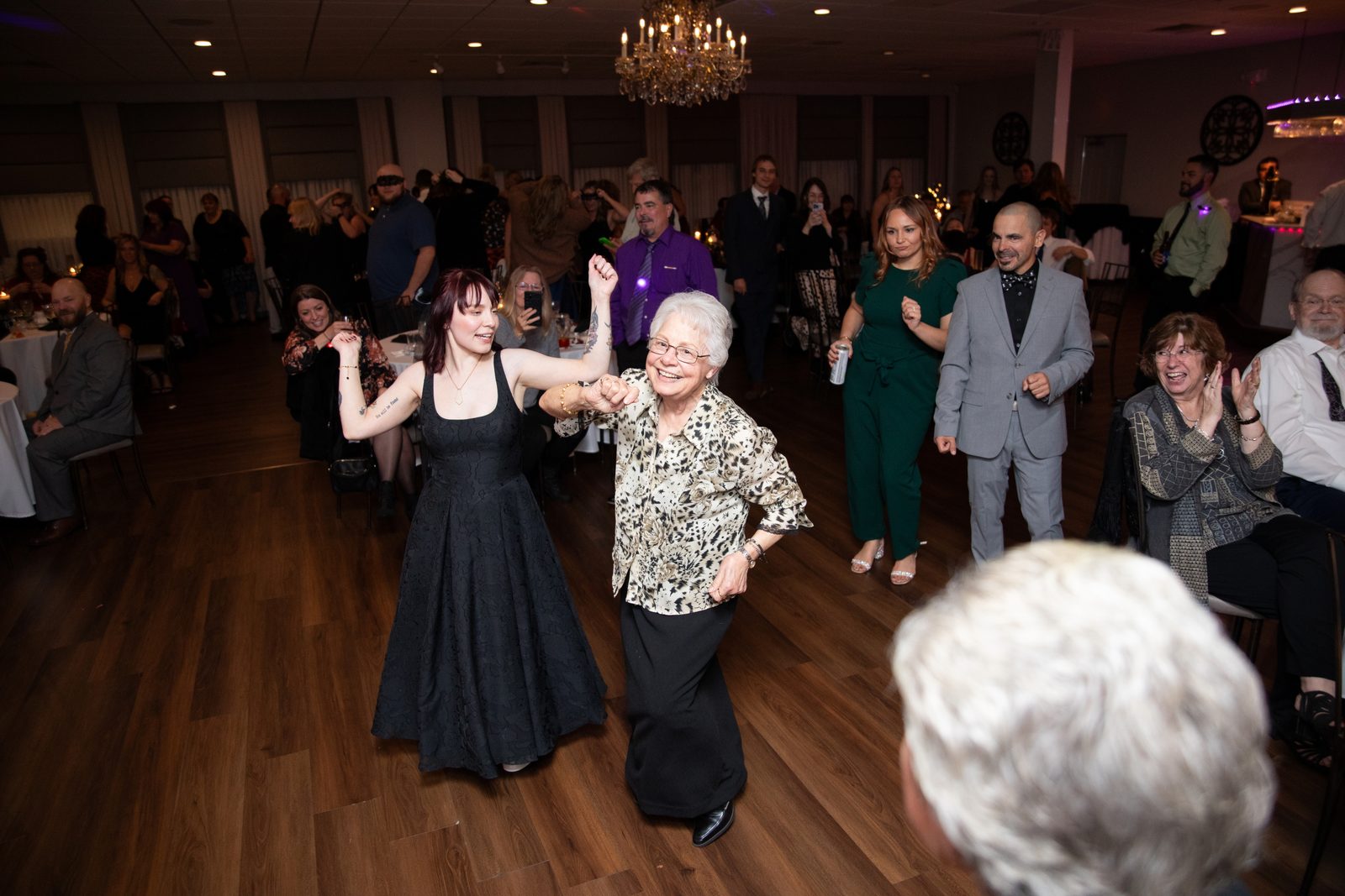 Wedding guests of every generation dancing together at Maravela's